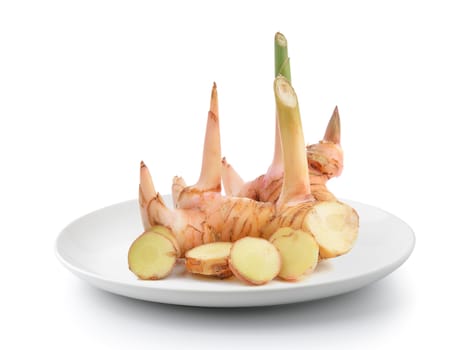 galangal in plate isolated on a white background