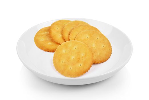 Cracker in plate on white background