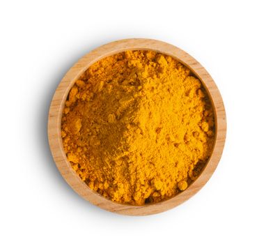 Turmeric (Curcuma) powder pile in wood bowl isolated on white background, top view