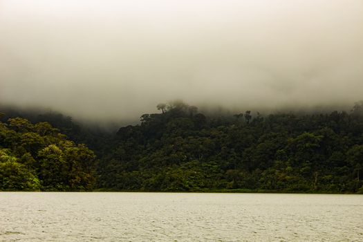 Two identical mountain lakes that are on top of the mountains on the island of Negros. Fog.