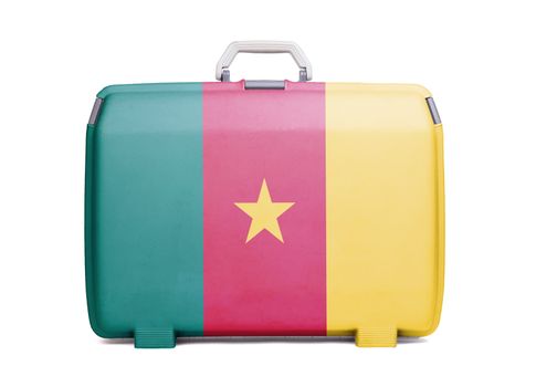 Used plastic suitcase with stains and scratches, printed with flag, Cameroon