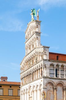 White marble ornamental portal of San Michele in Foro - Roman Catholic basilica in Lucca, Tuscany, Italy.