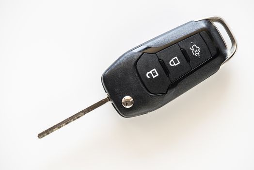 Close up of Remote electronic car key with mechanical second opening on white background.