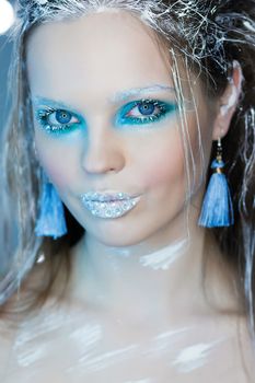 Beautiful Girl's Face.Creative Winter Makeup.Professional Makeup False Eyelashes