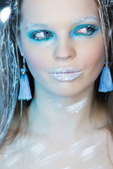 Beautiful Girl's Face.Creative Winter Makeup.Professional Makeup False Eyelashes