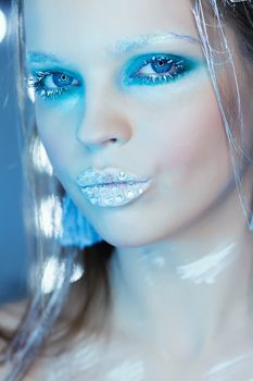 Beautiful Girl's Face.Creative Winter Makeup.Professional Makeup False Eyelashes