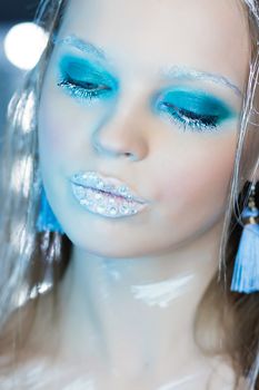 Beautiful Girl's Face.Creative Winter Makeup.Professional Makeup False Eyelashes