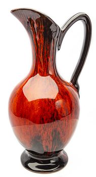 Red and black water pitcher isolated on white background