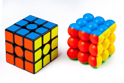 Two magic cubes on an isolated studio background