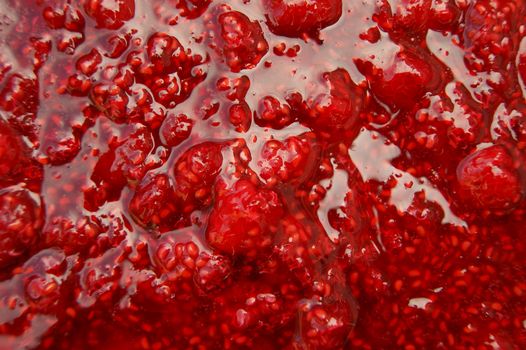 Background from mass of the fresh raspberry jam