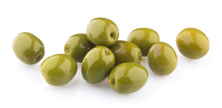 Heap of green olives isolated on white background, close up. Top view