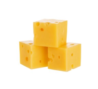 Heap of cheese cubes isolated on a white background. With clipping path.