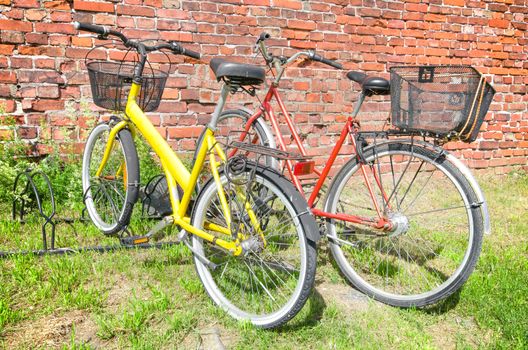 Vintage Bicycles over a brick wall background.