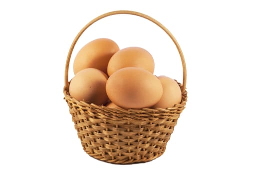 Eggs in a basket over white isolated background