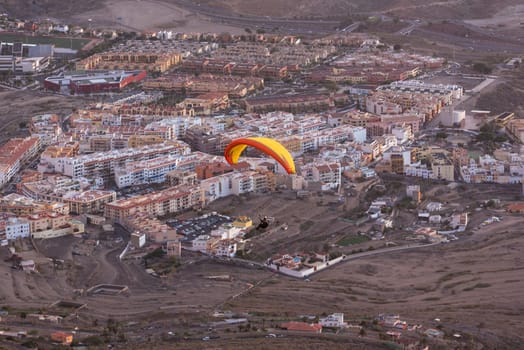 Paraglider flying over Adeje village in south Tenerife island, Canary islands, Spain.