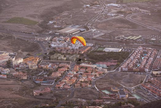 Paraglider flying over Adeje village in south Tenerife island, Canary islands, Spain.