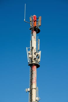 Mobile antenna on blue sky background