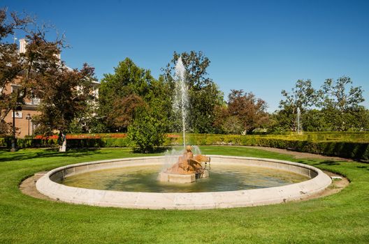 Fountain and gardens of Aranjuez Royal palace in Madrid, Spain.