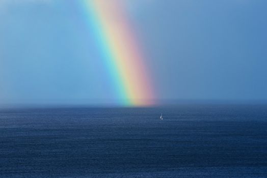 Beautiful rainbow on the ocean horizon