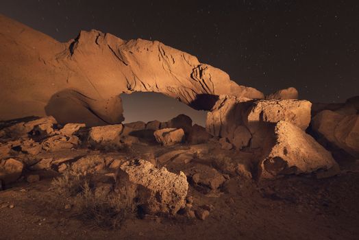 Starry night landscape of a volcanic Rock arch in Tenerife, Canary island, Spain.