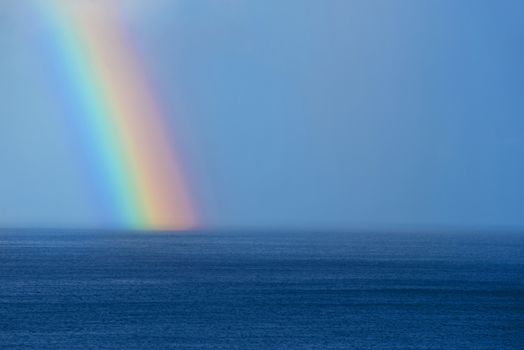 Beautiful rainbow on the ocean horizon