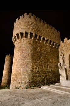 Night scene of famous Avila city walls in Castilla y Leon, Spain.