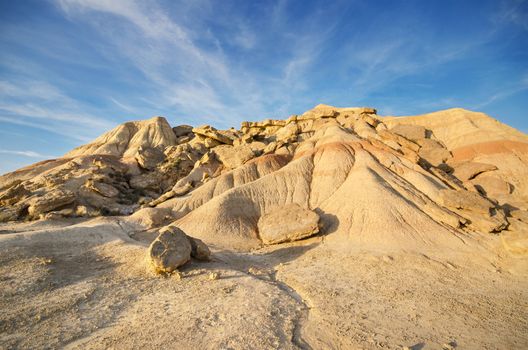 Scenic view of a desertic landscape at sunset in Bardenas Reales, Navarra, Spain.