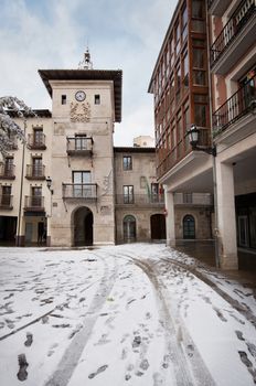 Winter scene of a snowed cityscape landscape of the ancient village of Briviesca in Burgos Province, Castilla y Leon, Spain.
