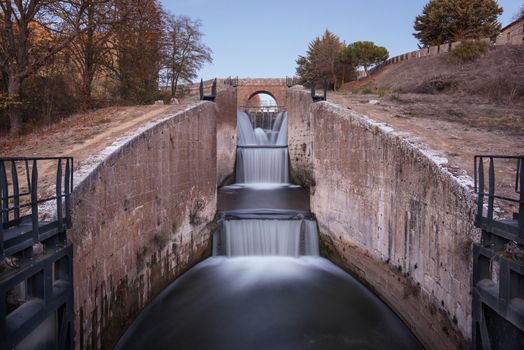 Waterfall in Touristic attraction Canal de Castilla, famous landmark in Palencia, Spain.