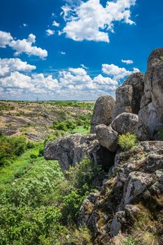 Panoramic view of deep granite Aktovo canyon with river and cloudy sky, One of the natural wonders of Ukraine.