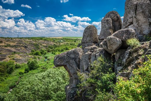 Panoramic view of deep granite Aktovo canyon with river and cloudy sky, One of the natural wonders of Ukraine.