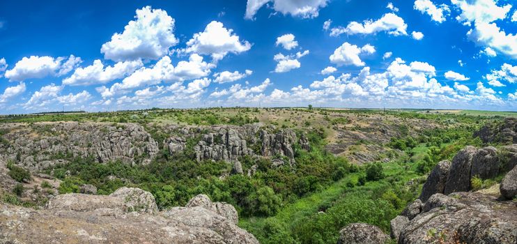 Panoramic view of deep granite Aktovo canyon with river and cloudy sky, One of the natural wonders of Ukraine.