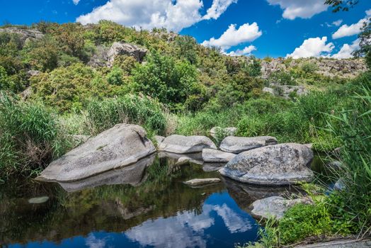 Panoramic view of deep granite Aktovo canyon with river and cloudy sky, One of the natural wonders of Ukraine.