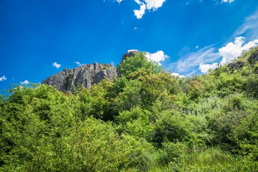 Panoramic view of deep granite Aktovo canyon with river and cloudy sky, One of the natural wonders of Ukraine.