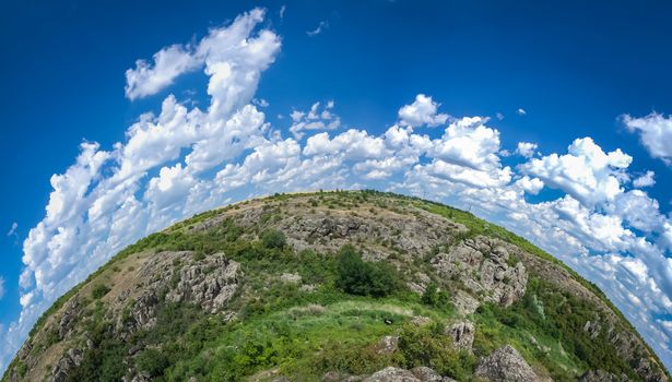 Panoramic view of deep granite Aktovo canyon with river and cloudy sky, One of the natural wonders of Ukraine.