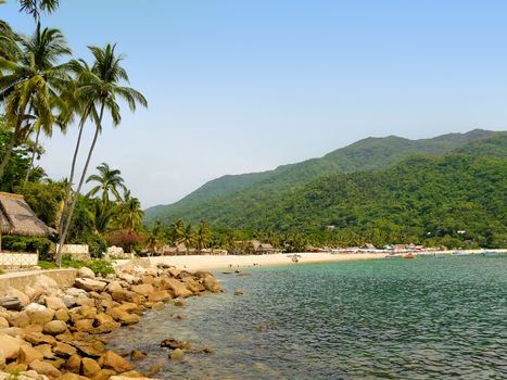 Yelapa Beach on a sunny day, one of the most beautiful beaches near Puerto Vallarta, resort town in Mexico on the Pacific coast, in the state of Jalisco. The image was taken in July.