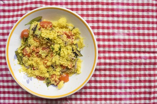 salad of cous cous with variety of roasted and raw vegetable