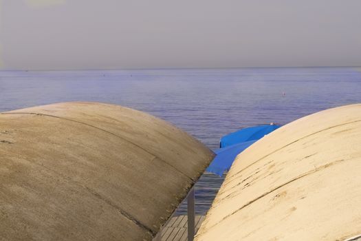 colors at sea with bathing hut beach umbrella and lifejacket