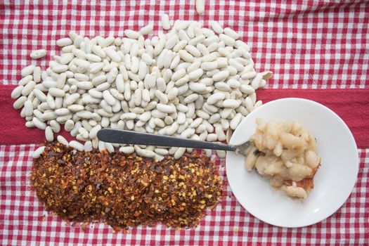 boiled haricot beans seasoned with crushed red pepper