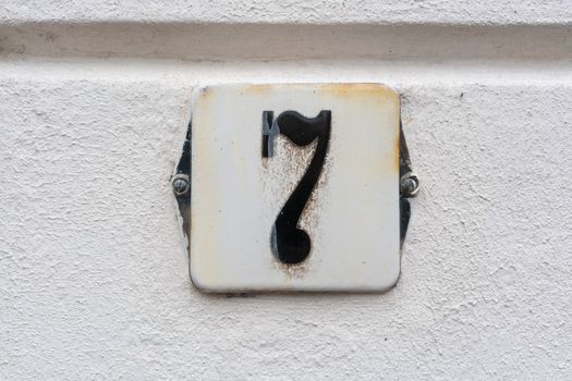 Enameled house number seven (7)