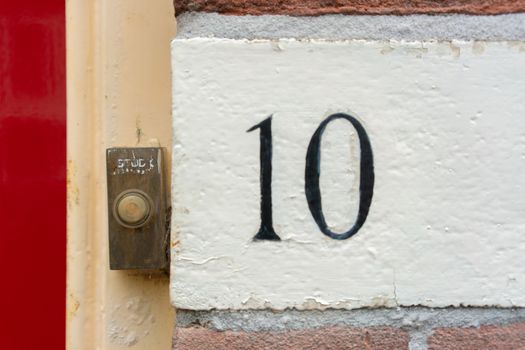 Hand painted house number ten (10)