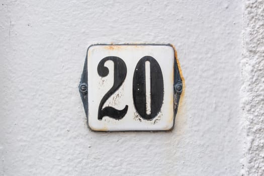 Enameled house number twenty (20)