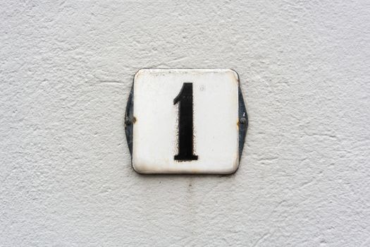 Enameled house number one (1)