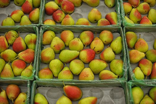 In supermarket. Pears at the grocery store