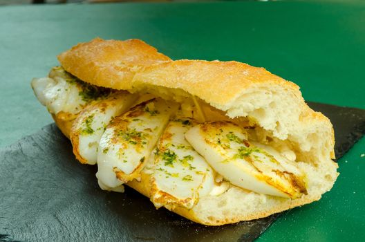 sepia sandwich with green sauce with garlic and parsley