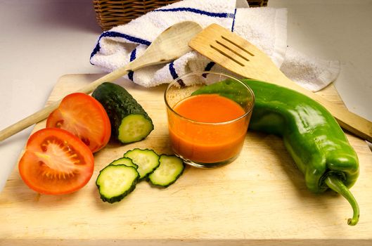 Gazpacho is a cold soup with ingredients such as olive oil, vinegar and raw vegetables: usually tomatoes, cucumbers, peppers, onions and garlic and bread. It is usually served fresh in the hot summer months.