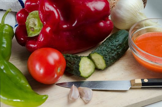 Gazpacho is a cold soup with ingredients such as olive oil, vinegar and raw vegetables: usually tomatoes, cucumbers, peppers, onions and garlic and bread. It is usually served fresh in the hot summer months.