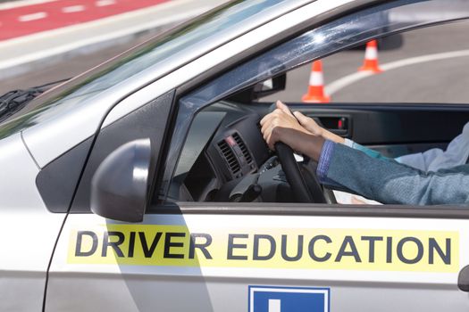 Learning to drive a car. Driving school. Driver education.