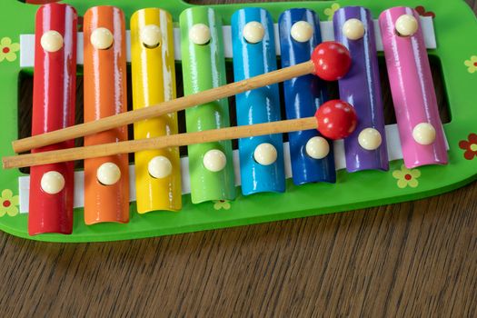 Musical instrument xylophone. Rainbow colored toy xylophone.