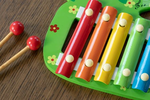 Musical instrument xylophone. Rainbow colored toy xylophone.